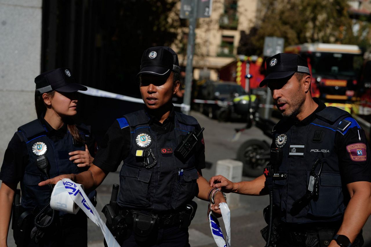 Spanish firefighters respond to building collapse in Madrid