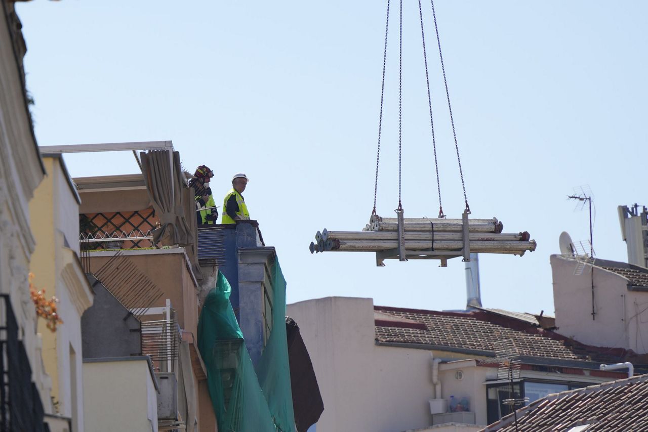 Spanish firefighters respond to building collapse in Madrid