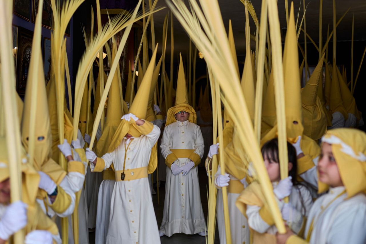 Spain begins Holy Week with processions, palm branches and familiar faces