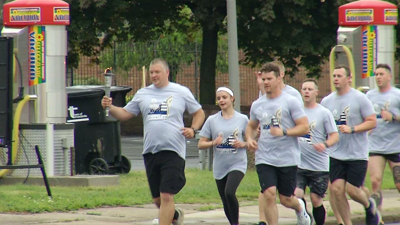 runners carry flame of hope
