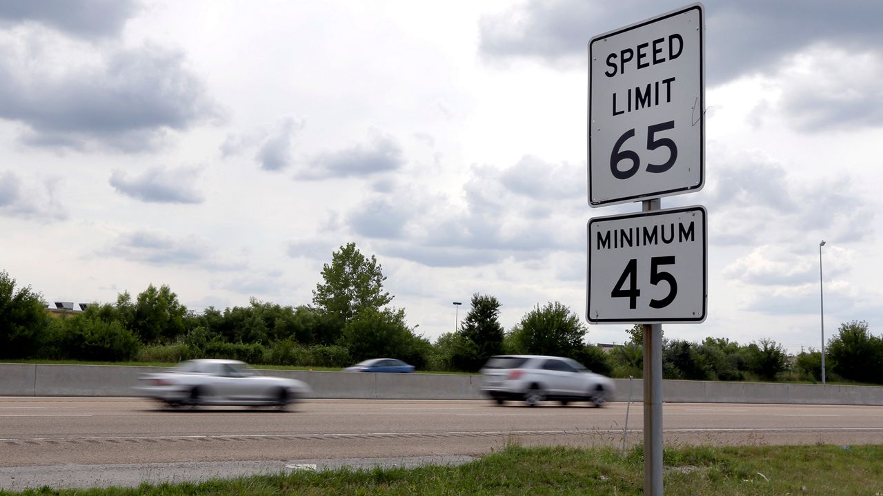 Vehicles pass a speed limit sign along Interstate 64 in O'Fallon, Ill. Charles City Police Department is cracking down on speeding this summer. (AP Photo/Jeff Roberson)