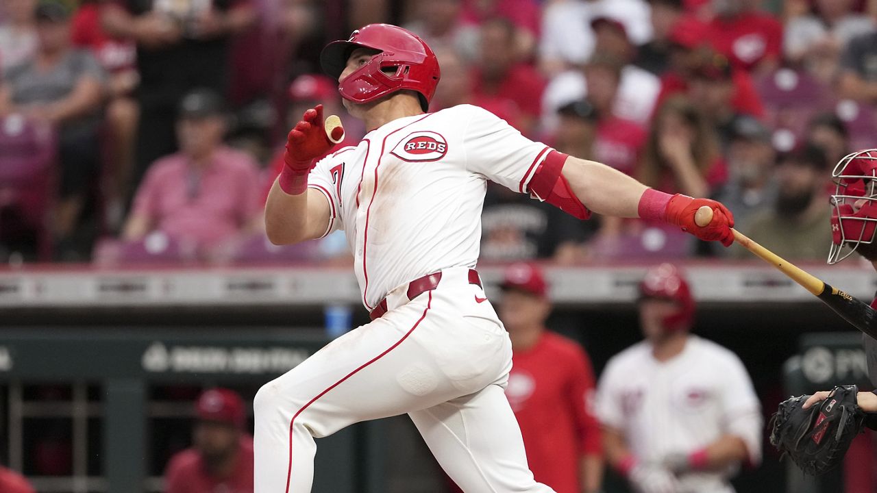 Cincinnati Reds' Spencer Steer follows through on a three-run home run during the fifth inning of a baseball game against the St. Louis Cardinals, Monday, Aug. 12, 2024, in Cincinnati. (AP Photo/Kareem Elgazzar)