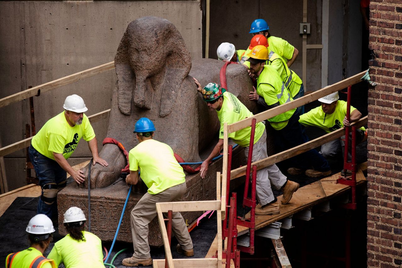 Huge sphinx makes crawling journey to new spot in museum