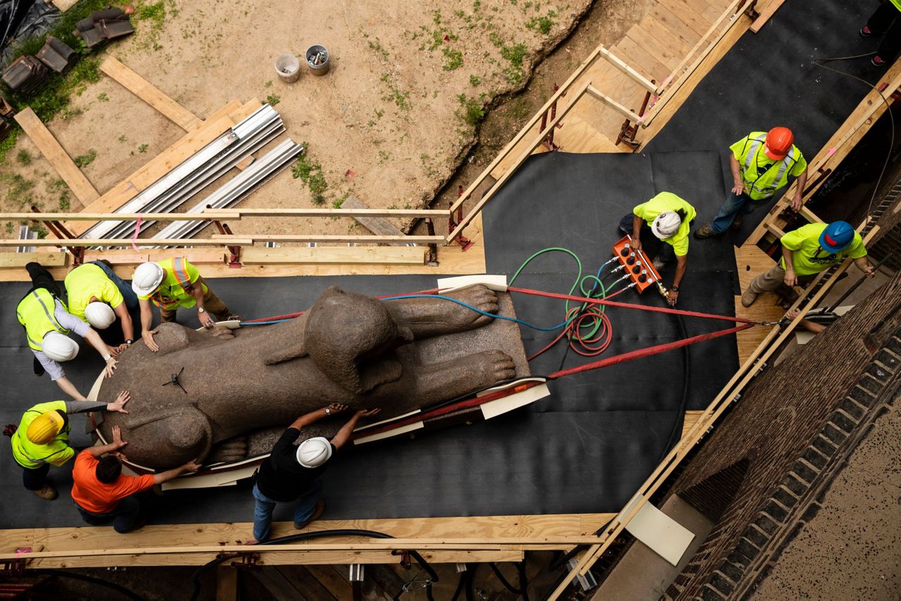 Huge sphinx makes crawling journey to new spot in museum