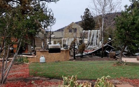 Large tumbleweeds sweep through neighborhood, cover houses