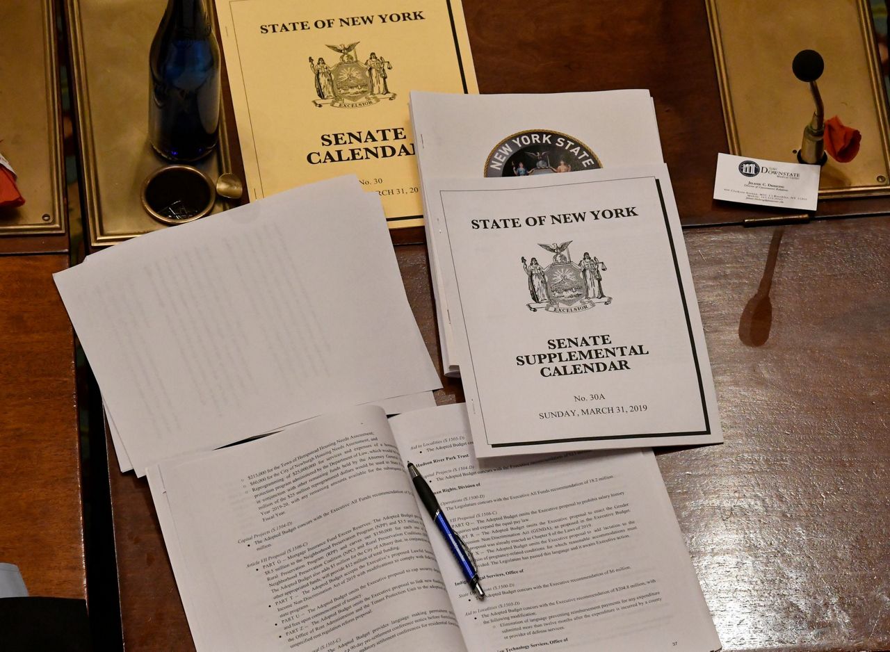 Manhattan tolls, plastic bag ban approved in New York budget