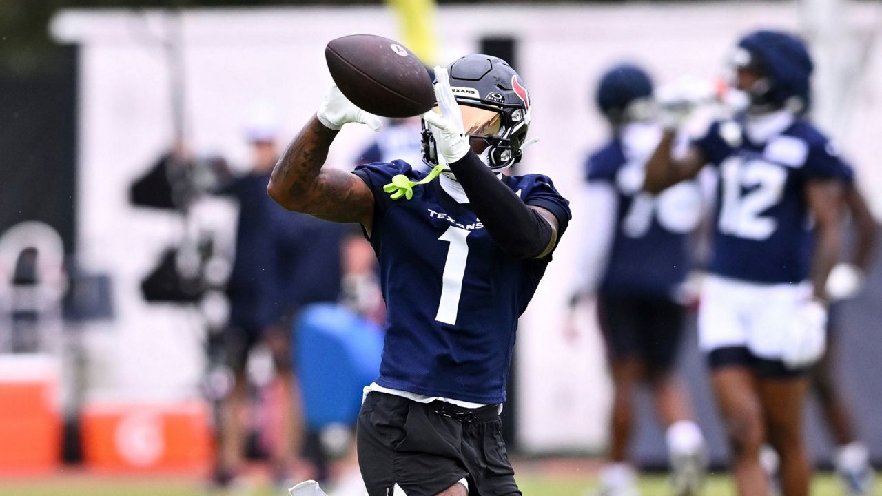 Houston Texans wide receiver Stefon Diggs (1) catches a pass during NFL football training camp, Thursday, July 18, 2024, Houston. (AP Photo/Maria Lysaker)