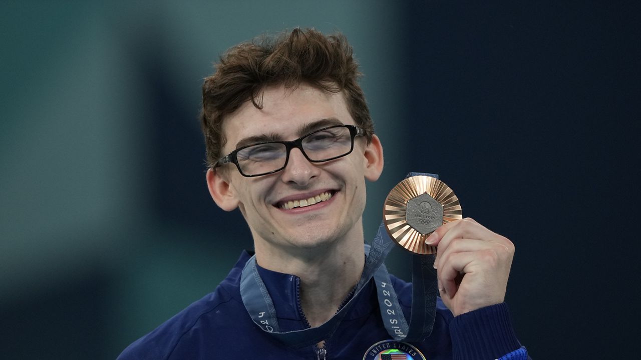 Stephen Nedoroscik, of the United States, celebrates after winning the bronze medal during the men's artistic gymnastics individual pommel finals at Bercy Arena at the 2024 Summer Olympics, Saturday, Aug. 3, 2024, in Paris, France. (AP Photo/Charlie Riedel)