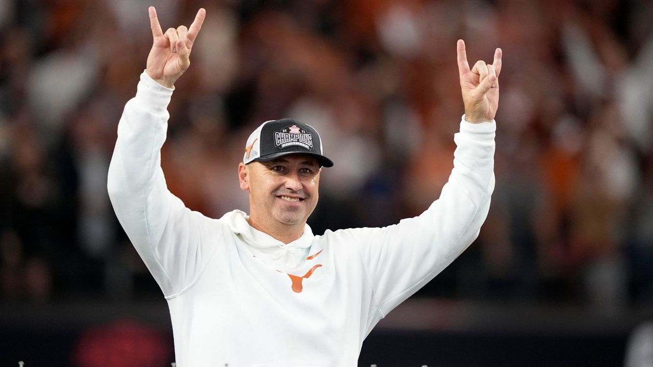 Texas head coach Steve Sarkisian celebrates after his team won the Big 12 Conference championship NCAA college football game against Oklahoma State in Arlington, Texas, Saturday, Dec. 2, 2023. (AP Photo/Tony Gutierrez, File)