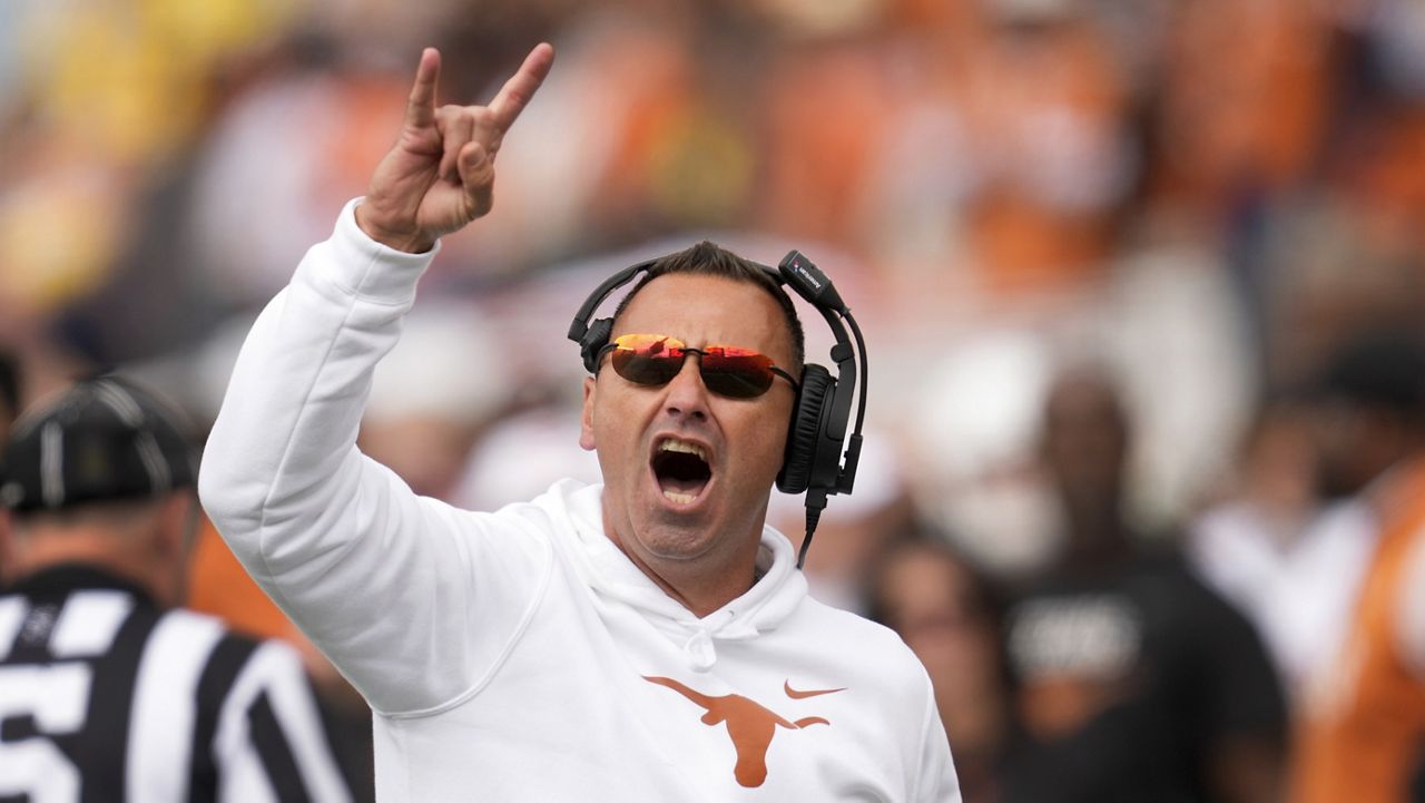 Texas head coach Steve Sarkisian reacts to fans in the second half of an NCAA college football game against Michigan in Ann Arbor, Mich., Saturday, Sept. 7, 2024. (AP Photo/Paul Sancya)