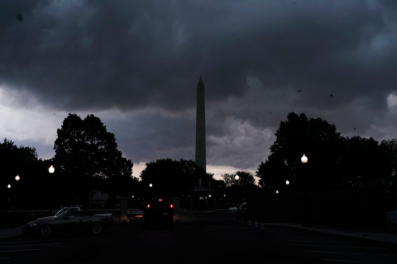 Storm clouds pass over the Washington Monument, Monday, Aug. 7, 2023, in Washington. Thousands of federal employees were sent home early Monday as the Washington area faced a looming forecast for destructively strong storms, including tornadoes, hail and lightning. (AP Photo/Jacquelyn Martin)