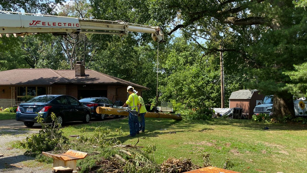 Ameren crews in Columbia, Illinois, repair a downed line after storms tore through the St. Louis region on Saturday, July 1, 2023.