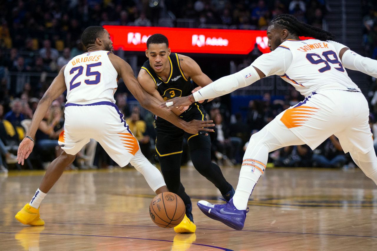 Booker, Paul deliver at end, Suns hold off Warriors 107103