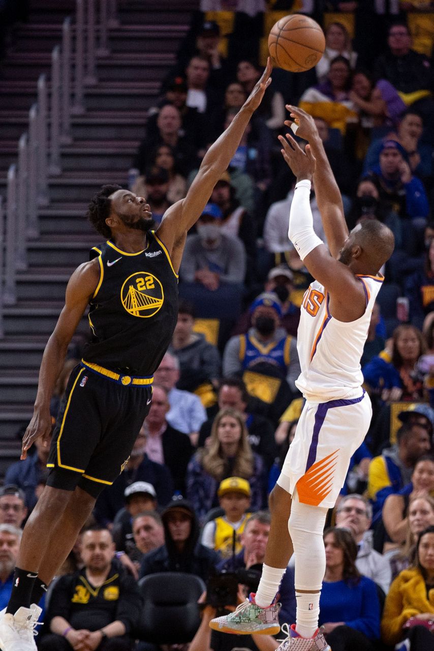 Booker, Paul deliver at end, Suns hold off Warriors 107103