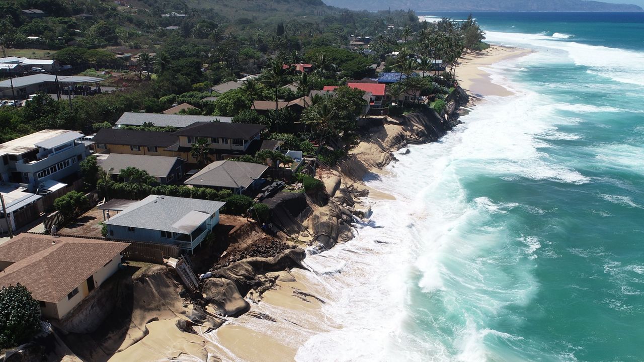 Youman's property (59-149 Ke Nui Road) is the turquoise house on the left, while the Kernots home (59-151 A Ke Nui Road) is the darker blue house on the right. (Photo courtesy of DLNR)