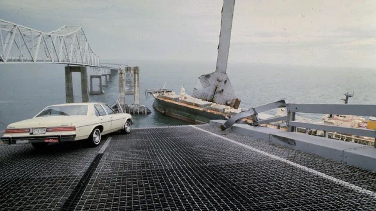 A car is halted at the edge of the Sunshine Skyway Bridge across Tampa Bay, Fla., after the freighter Summit Venture struck the bridge during a thunderstorm and tore away a large part of the span, May 9, 1980. (AP Photo / Jackie Green)