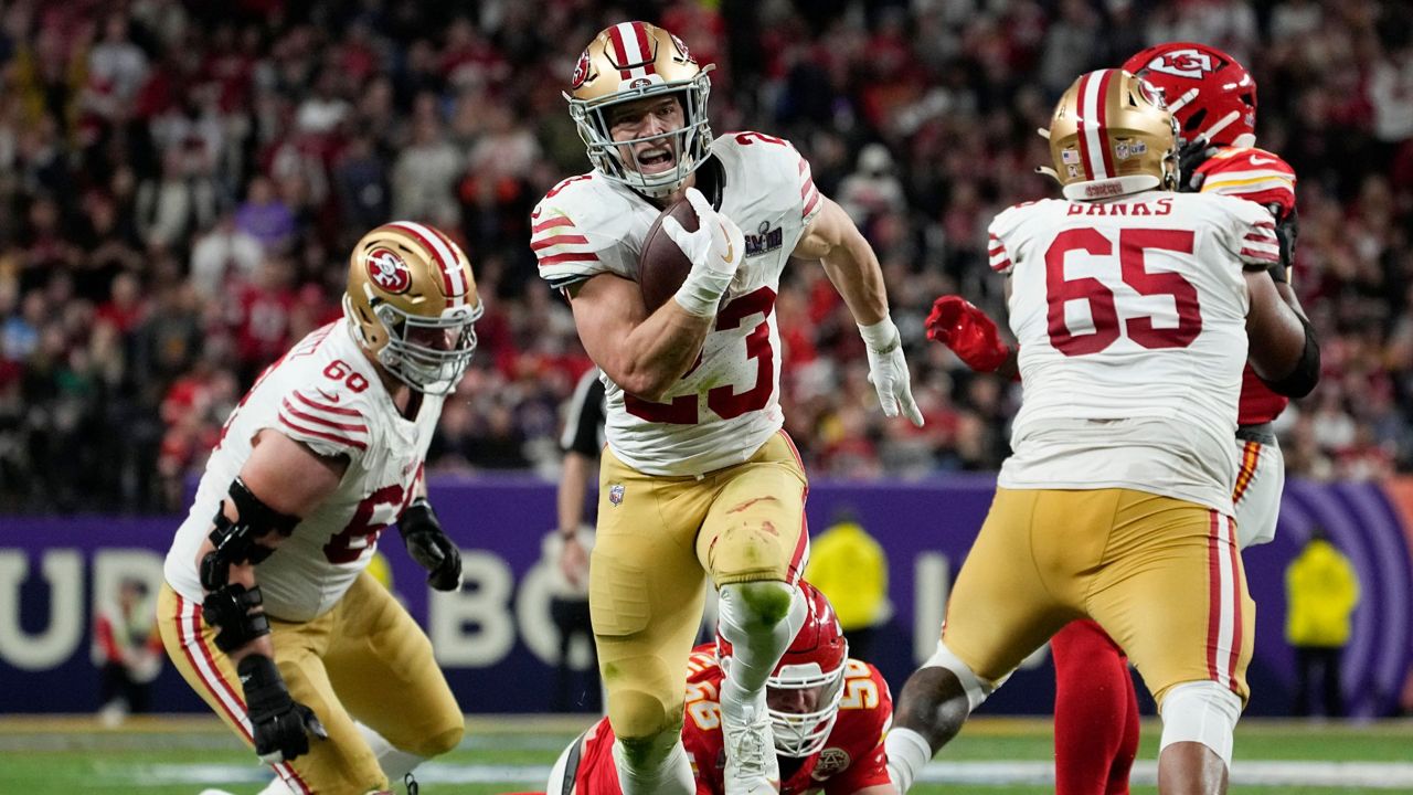 San Francisco 49ers running back Christian McCaffrey (23) runs into the end zone for a topuchdown against the Kansas City Chiefs during the first half of the NFL Super Bowl 58 football game Sunday, Feb. 11, 2024, in Las Vegas. (AP Photo/George Walker IV)
