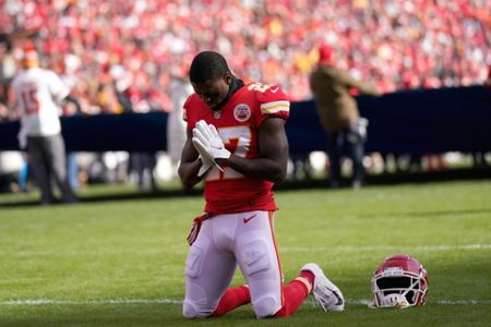 Cincinnati Bengals players kneel as Damar Hamlin is examined