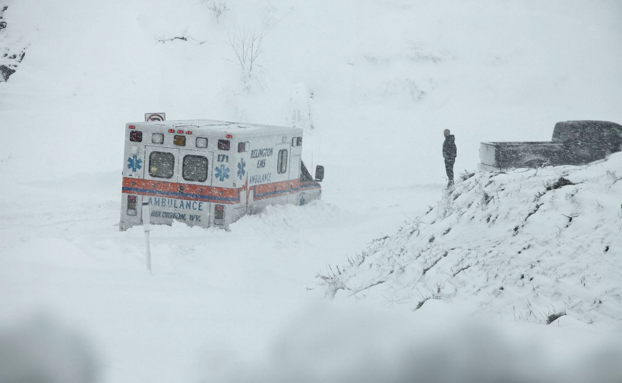 In this Tuesday, Oct. 30, 2012 file photo, an ambulance is stuck in over a foot of snow off of Highway 33 West near Belington, W.Va. Superstorm Sandy was the first time the National Hurricane Center ever listed snow or blizzard in their warnings. Three feet of snow fell in West Virginia. (AP Photo/Robert Ray, File)