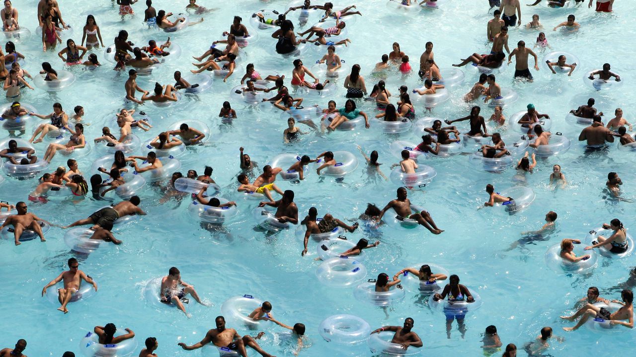 Swimmers try to stay cool in near 100 degree temperatures at Red Oaks Waterpark in Madison Heights, Mich., June 28, 2012. (AP Photo/Paul Sancya, File)