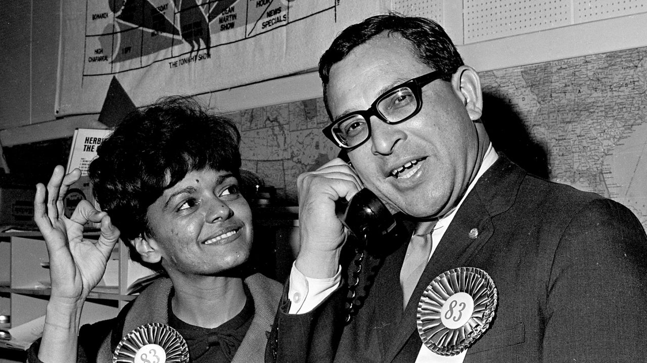 Attorney Ernest Morial, right, speaks on the telephone as his wife, Sybil, looks on after he won an outright victory in his race for a House seat in the Louisiana Legislature, in New Orleans, Nov. 5, 1967. (AP Photo/Jack Thornell)