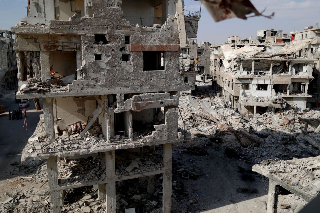 AP PHOTOS: Clearing the rubble in Syria's Yarmouk camp