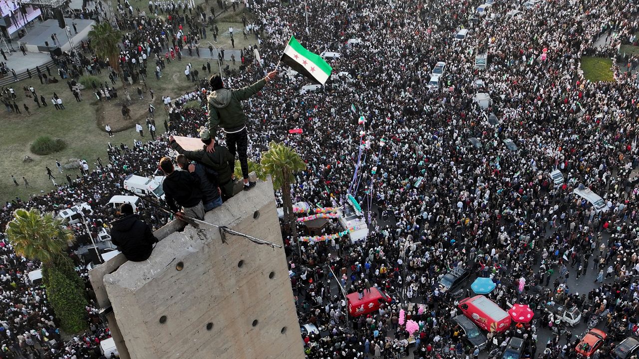 Syrians continue to celebrate the ousting of Bashar al-Assad's government, at Umayyad Square, in Damascus, Syria, Friday, Dec. 20, 2024. (AP Photo/Hussein Malla)