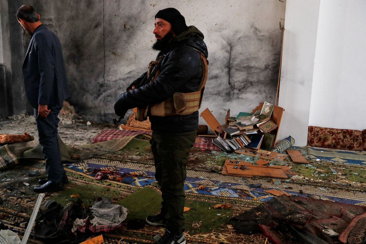 Hundreds mourn in Syria's Homs after deadly mosque bombing