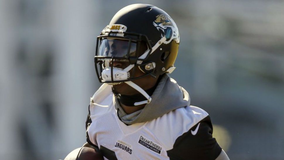 FILE - In this Jan. 19, 2018 file photo, Jacksonville Jaguars running back T.J. Yeldon (24) runs with the ball during an NFL football practice in Jacksonville, Fla. Yeldon hasn’t started a game in nearly two years. It was a frustrating stretch that forced him to work harder and be more patient. He always felt like he would get another shot. He didn’t expect it to be this week. But with Leonard Fournette missing practice because of a strained right hamstring, Yeldon is getting the majority of practice repetitions and preparing to carry the load Sunday against the New England Patriots. (AP Photo/Gary McCullough)