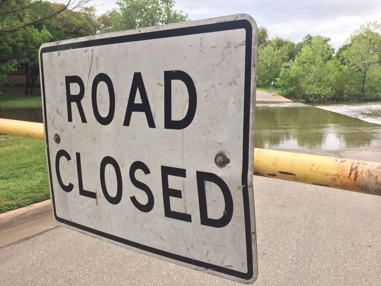 Road closed with water spilling onto the roadway in Round Rock. 