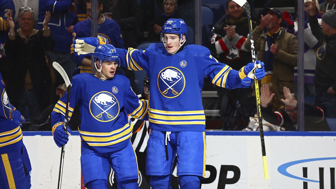 Buffalo Sabres center Tage Thompson (72) celebrates after his goal with right wing JJ Peterka (77) during the first period of an NHL hockey game against the Philadelphia Flyers, Friday, April 5, 2024, in Buffalo, N.Y. (AP Photo/Jeffrey T. Barnes)