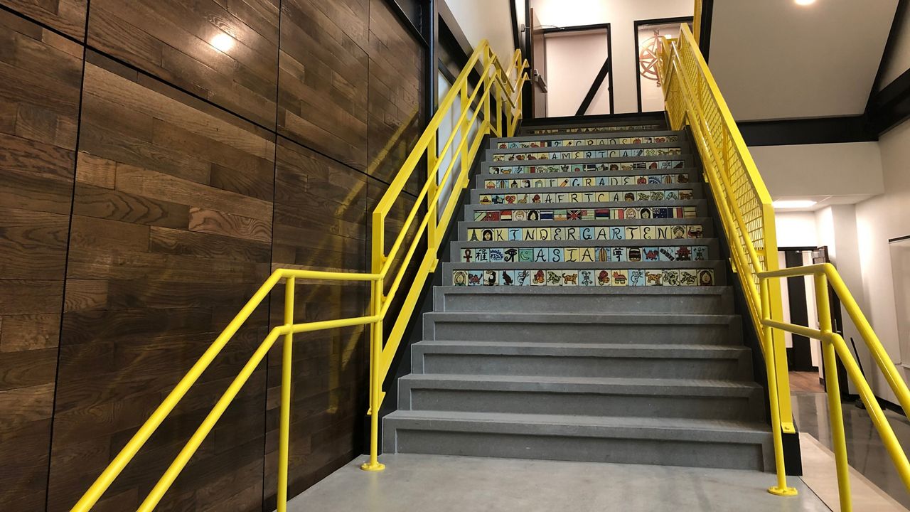 Staircase lined with wood from what was Robert E. Lee Elementary. The school is now called Tampa Heights Elementary and will reopen in January. (Laurie Davison/Spectrum News)