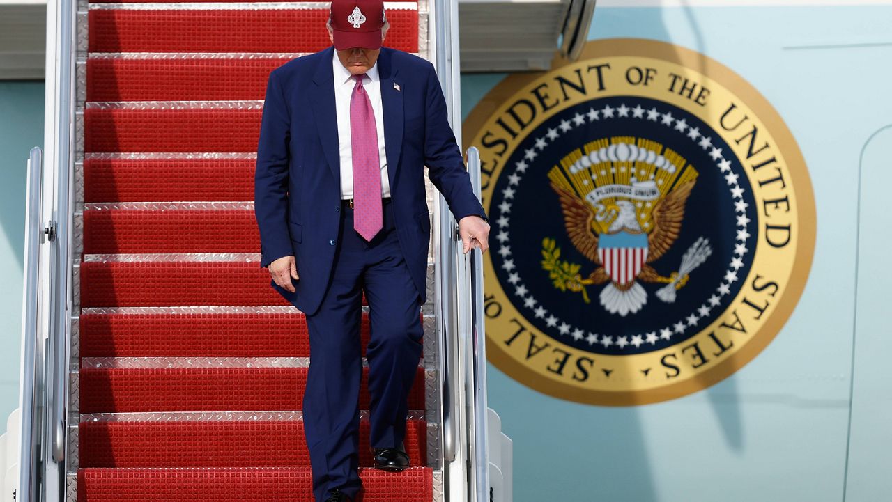 President Donald Trump walks down the stairs of Air Force One upon his arrival at Joint Base Andrews, Md., Tuesday, June 10, 2025. (AP Photo/Luis M. Alvarez)