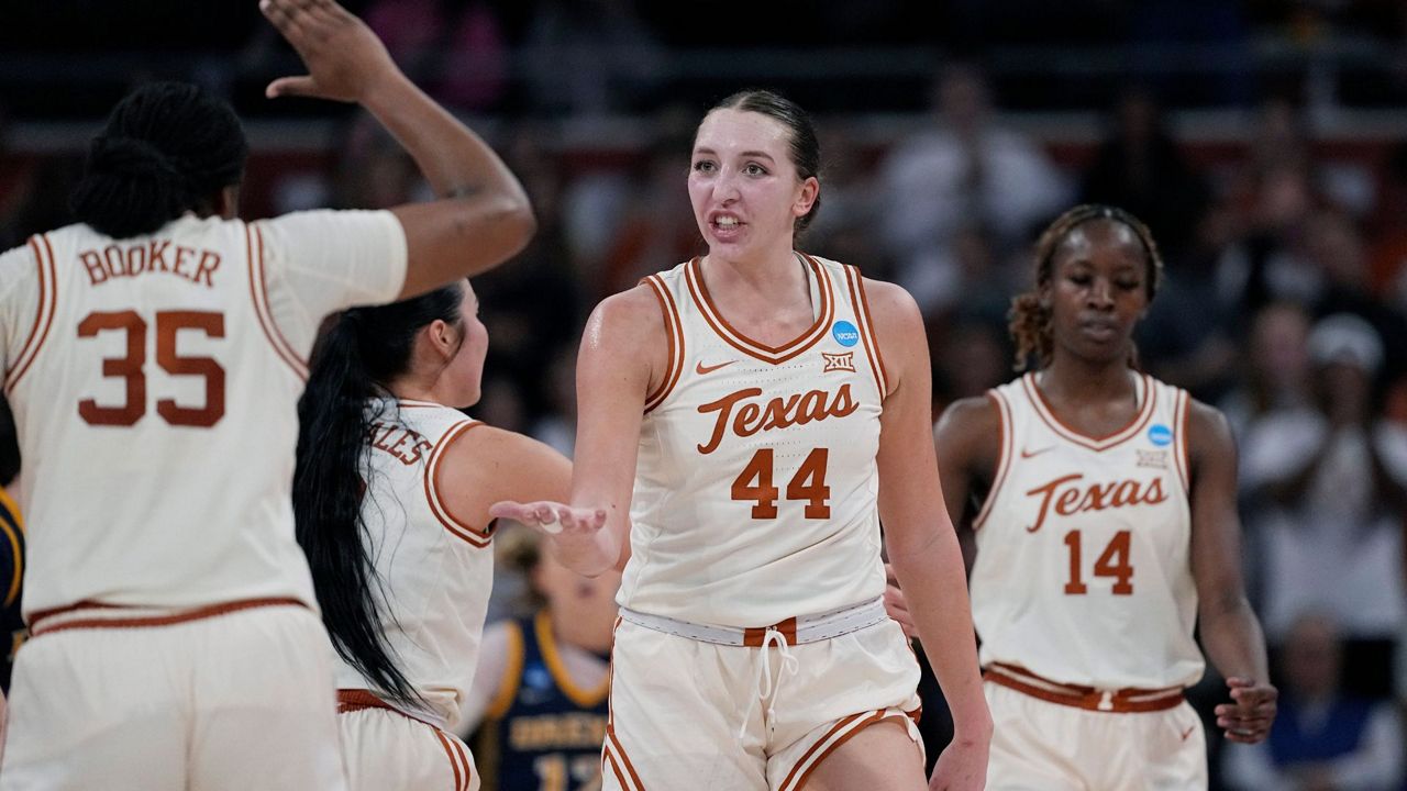 Texas forward Taylor Jones (44) celebrates a score with teammate Madison Booker (35) during the second half of a first-round college basketball game against Drexel in the women's NCAA Tournament in Austin, Texas, Friday, March 22, 2024. (AP Photo/Eric Gay)