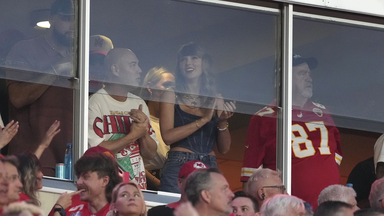 Taylor Swift is seen in a suite before the start of an NFL football game between the Kansas City Chiefs and the Baltimore Ravens Thursday, Sept. 5, 2024, in Kansas City, Mo. (AP Photo/Ed Zurga)