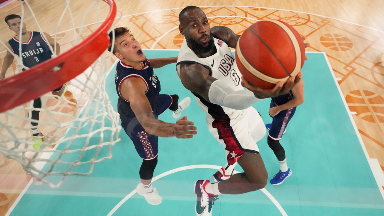 United States' LeBron James (6) shoots during a men's semifinal basketball game against Serbia at Bercy Arena at the 2024 Summer Olympics, Thursday, Aug. 8, 2024, in Paris, France. (AP Photo/Mark J. Terrill,Pool)