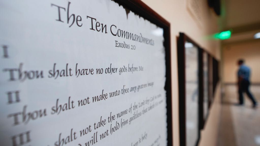 A copy of the Ten Commandments is posted along with other historical documents in a hallway of the Georgia Capitol, Thursday, June 20, 2024, in Atlanta. (AP Photo/John Bazemore, File)