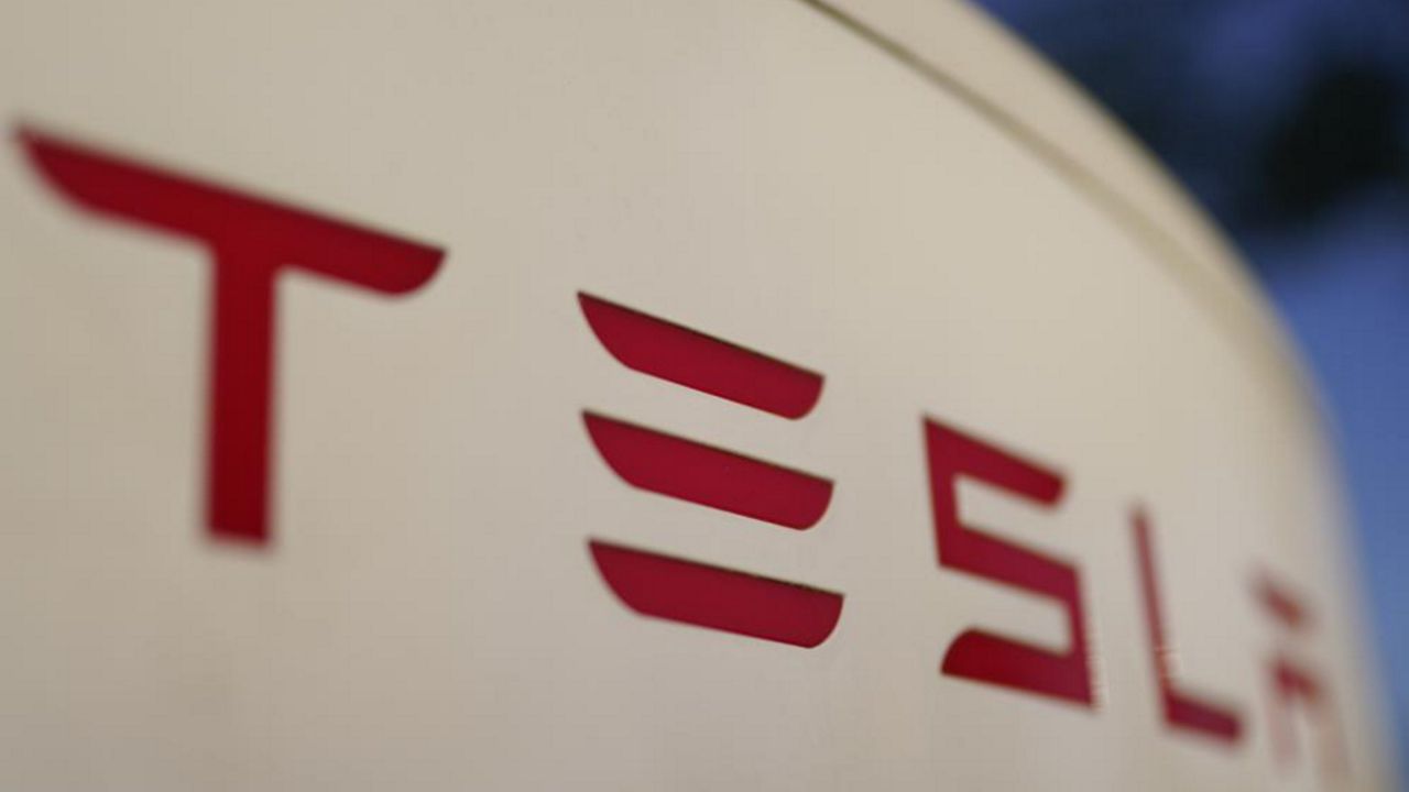 The Tesla logo appears in this file image. (AP Photos)