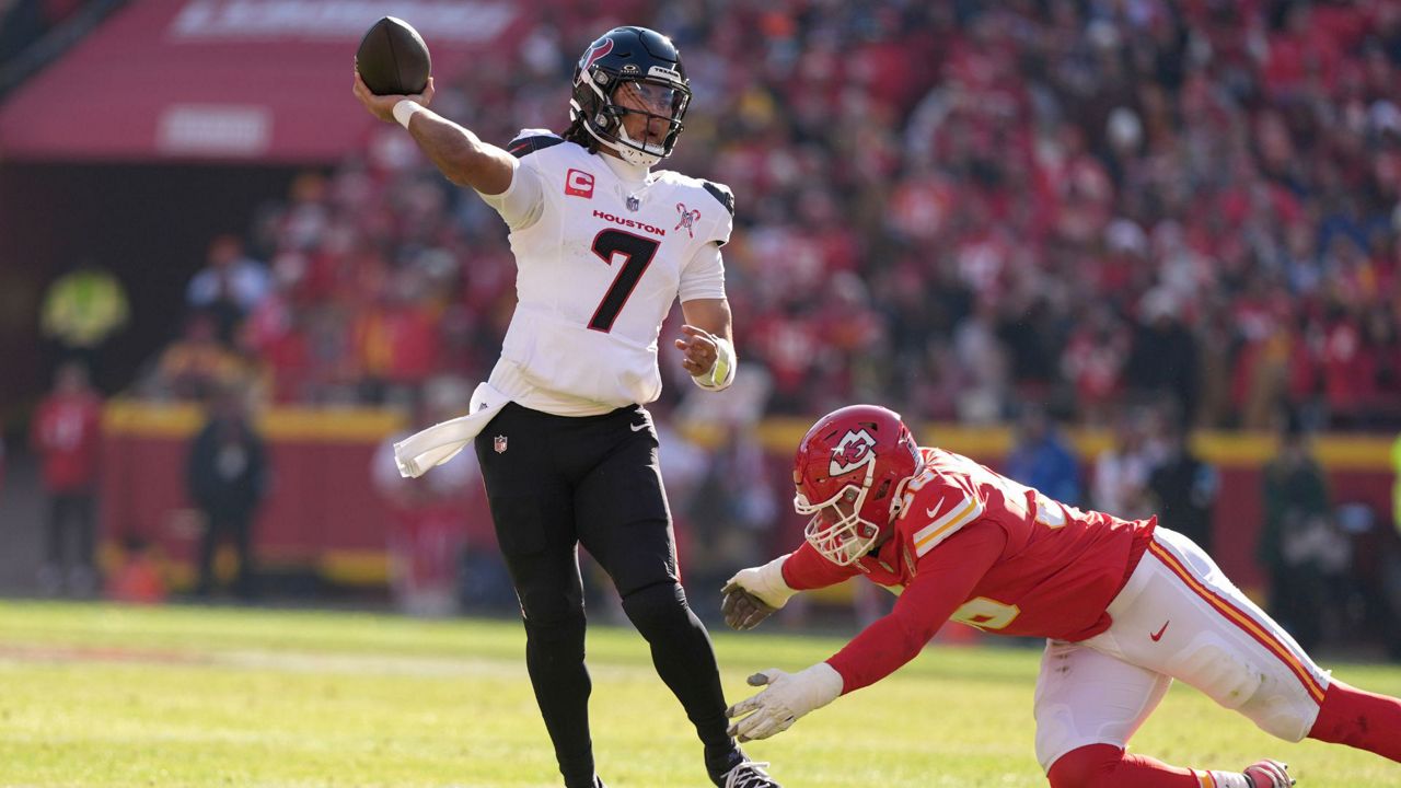 Houston Texans quarterback C.J. Stroud (7) throws a touchdown pass under pressure from Kansas City Chiefs defensive end George Karlaftis during the first half of an NFL football game Saturday, Dec. 21, 2024, in Kansas City, Mo. (AP Photo/Charlie Riedel)1