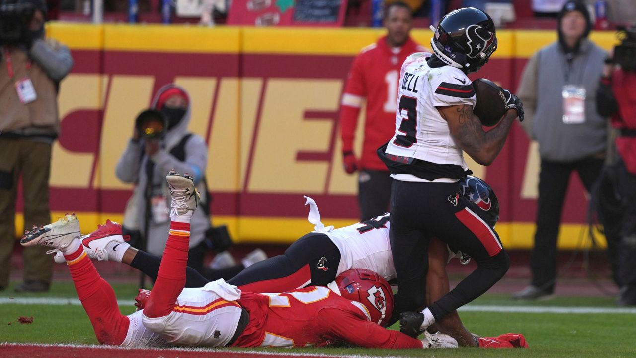 Houston Texans wide receiver Tank Dell (3) catches a touchdown pass as Kansas City Chiefs cornerback Trent McDuffie, left, defends during the second half of an NFL football game Saturday, Dec. 21, 2024, in Kansas City, Mo. Dell was injured on the play. (AP Photo/Charlie Riedel)