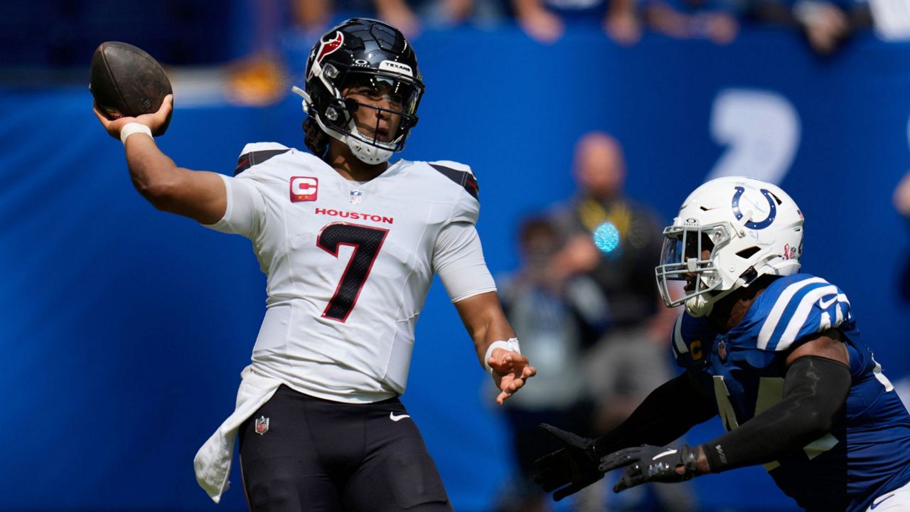 Houston Texans quarterback C.J. Stroud (7) throws as he is pressured by Indianapolis Colts linebacker Zaire Franklin (44) during the second half of an NFL football game, Sunday, Sept. 8, 2024, in Indianapolis. (AP Photo/Darron Cummings)