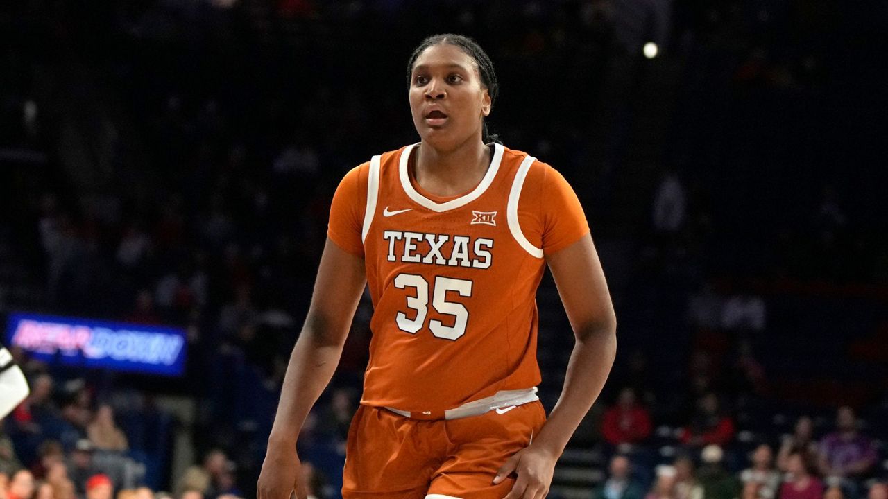 Texas forward Madison Booker (35) during the first half of an NCAA college basketball game against Arizona, Wednesday, Dec. 13, 2023, in Tucson, Ariz. (AP Photo/Rick Scuteri)