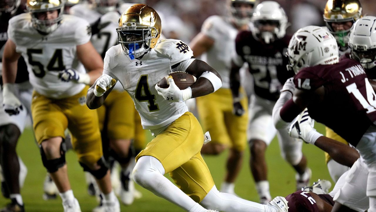 Notre Dame running back Jeremiyah Love (4) breaks free from Texas A&M linebacker Daymion Sanford (27) for a touchdown run late in the fourth quarter of an NCAA college football game Saturday, Aug. 31, 2024, in College Station, Texas. (AP Photo/Sam Craft)