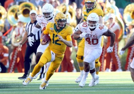 Baylor quarterback Charlie Brewer (12) is sacked by Oklahoma