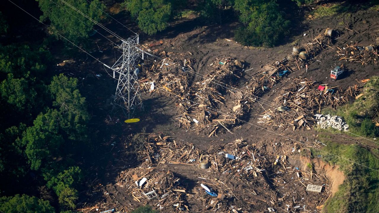This aerial photo shows damage from flash floods along the Guadalupe River in Kerr County, Texas, Thursday, July 10, 2025. (AP Photo/Gerald Herbert)