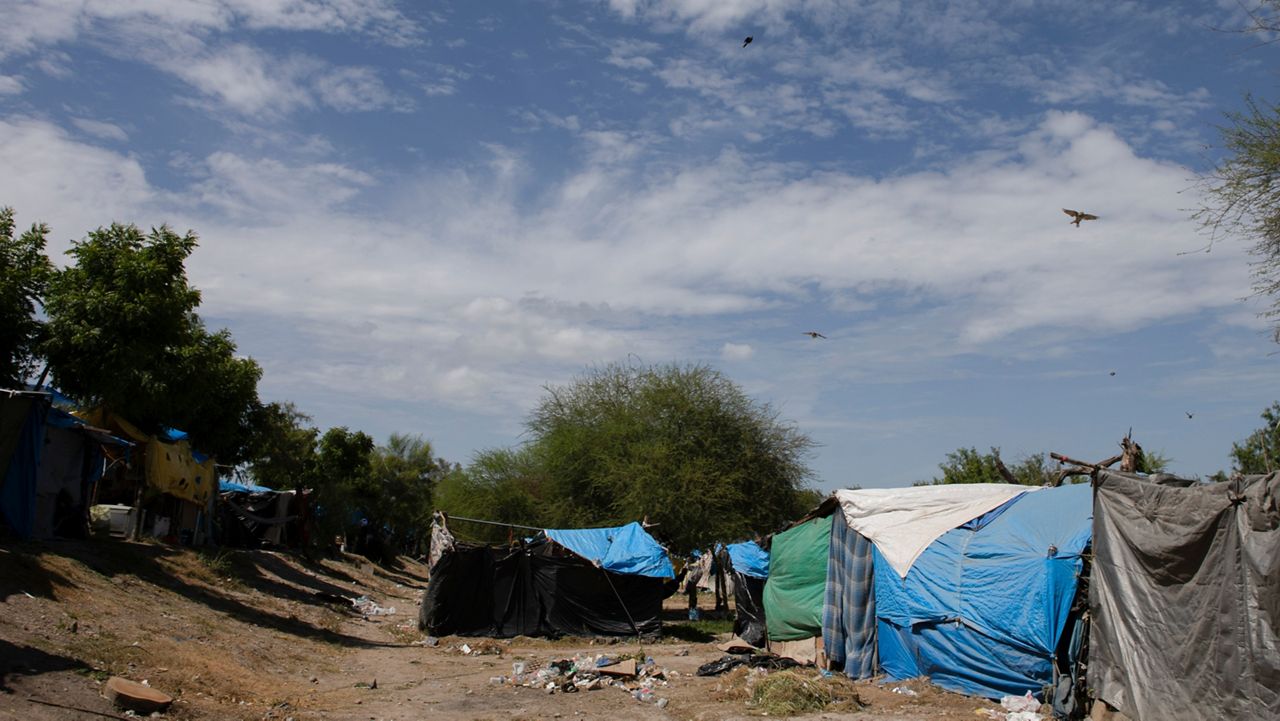 Makeshift tents are seen at a shelter encampment in the border town of Matamoros, Mexico, Wednesday, Aug. 16, 2023. (AP Photo/Jacky Muniello)