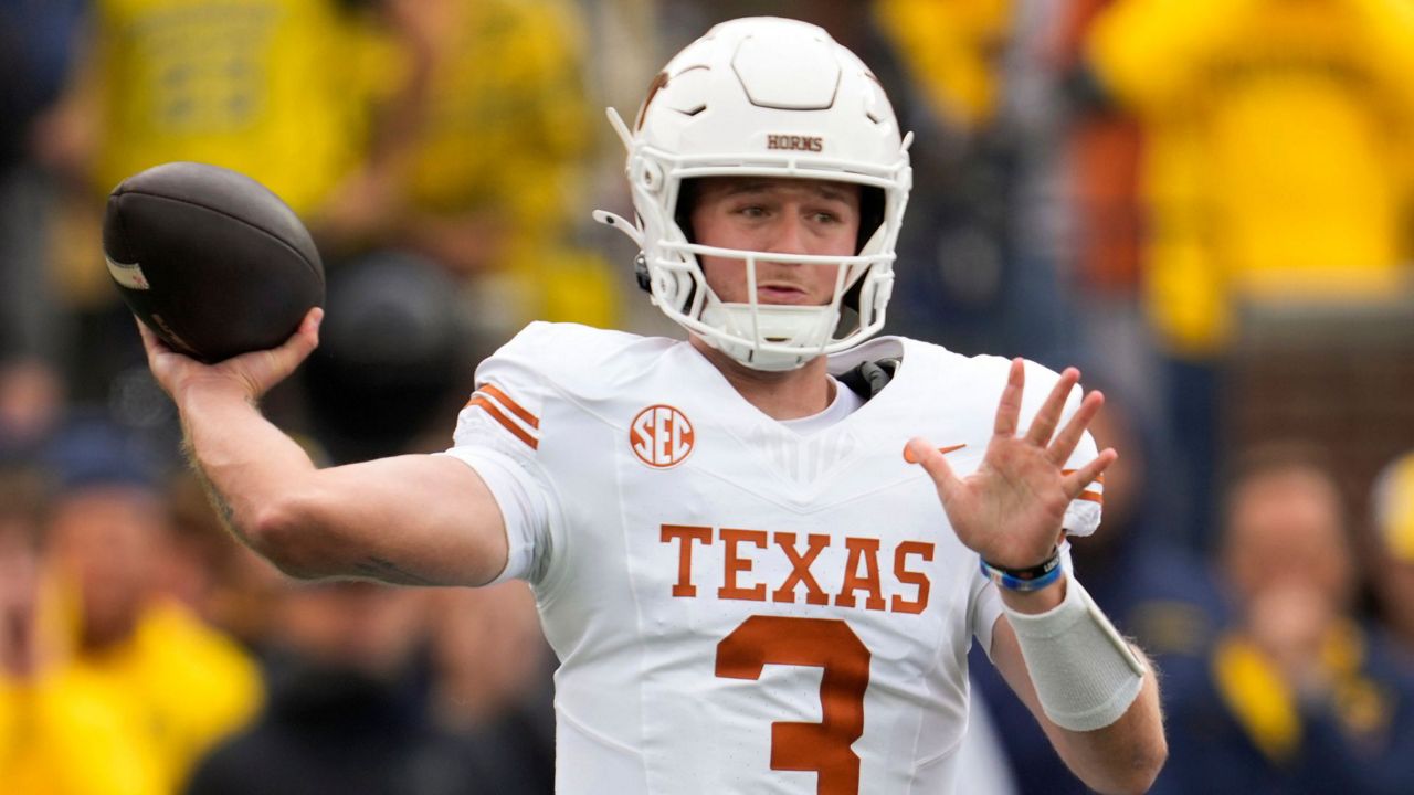 Texas quarterback Quinn Ewers throws against Michigan in the first half of an NCAA college football game in Ann Arbor, Mich., Saturday, Sept. 7, 2024. (AP Photo/Paul Sancya)