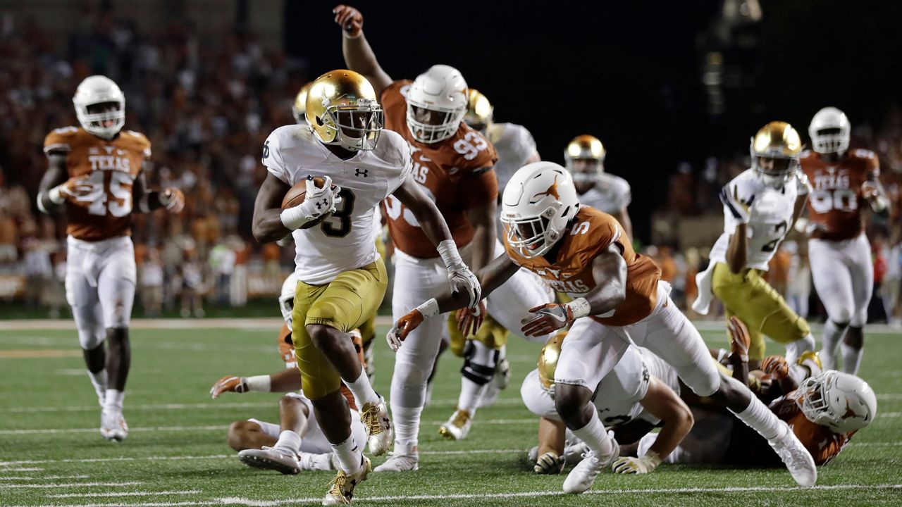 Notre Dame wide receiver C.J. Sanders (3) scores in overtime of a NCAA college football game against Texas, Sunday, Sept. 4, 2016, in Austin, Texas. (AP Photo/Eric Gay)