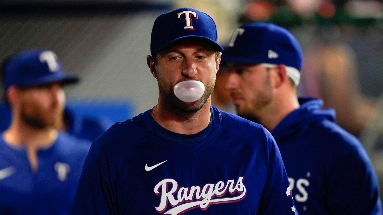 Marcus Semien of the Texas Rangers blows a bubble in the sixth inning  News Photo - Getty Images