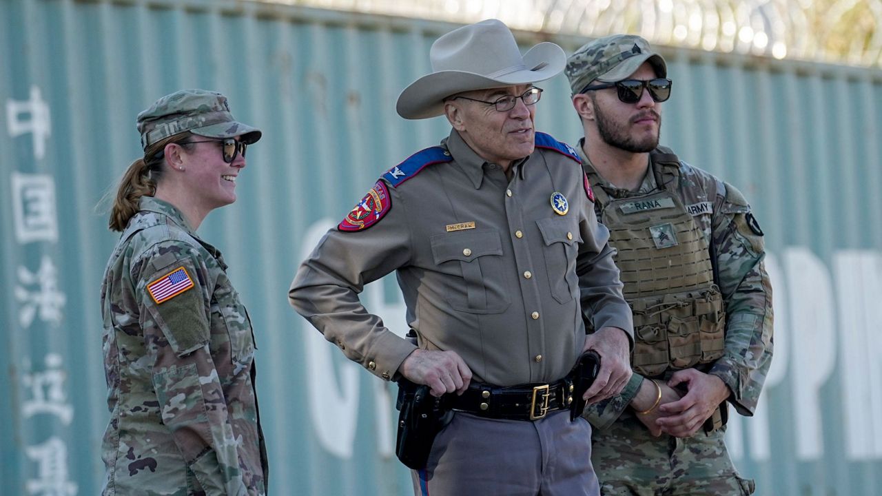 Texas Department of Public Safety Chief Steve McCraw, center, stands with officials as they wait for the arrival of Congressional members, Jan. 3, 2024, in Eagle Pass, Texas. (AP Photo/Eric Gay, File)